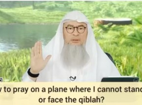 How to pray on a plane where I cannot stand up or face the qiblah?