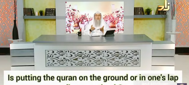 Is putting the Quran on the ground or in one's lap disrespecting the Quran?