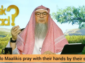 Why do Malikis put their hands by their sides when praying?