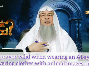 Is my prayer valid if I wear an abaya covering over clothes that have images on it?